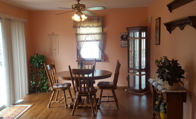 617 Stonegate Road New Lenox, IL 60451 - Photo 5 of 18 a view of a dining room with furniture and window