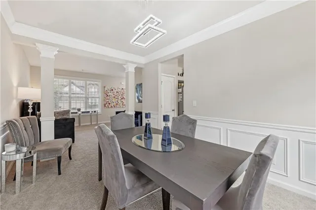 a view of a dining room with furniture and window