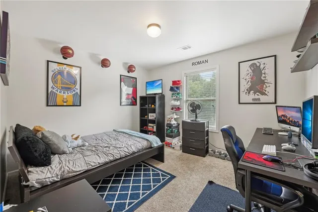 a bedroom with furniture and a bed