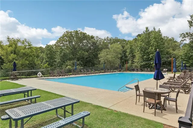 a view of a chairs and table in patio of the house