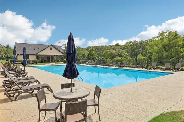 a view of a swimming pool with a patio