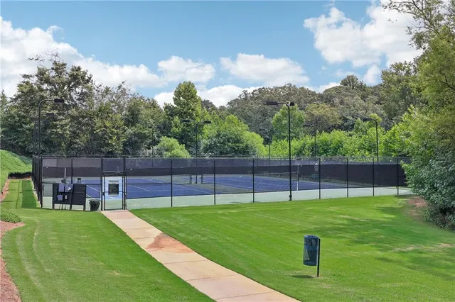 a view of a backyard with a swimming pool