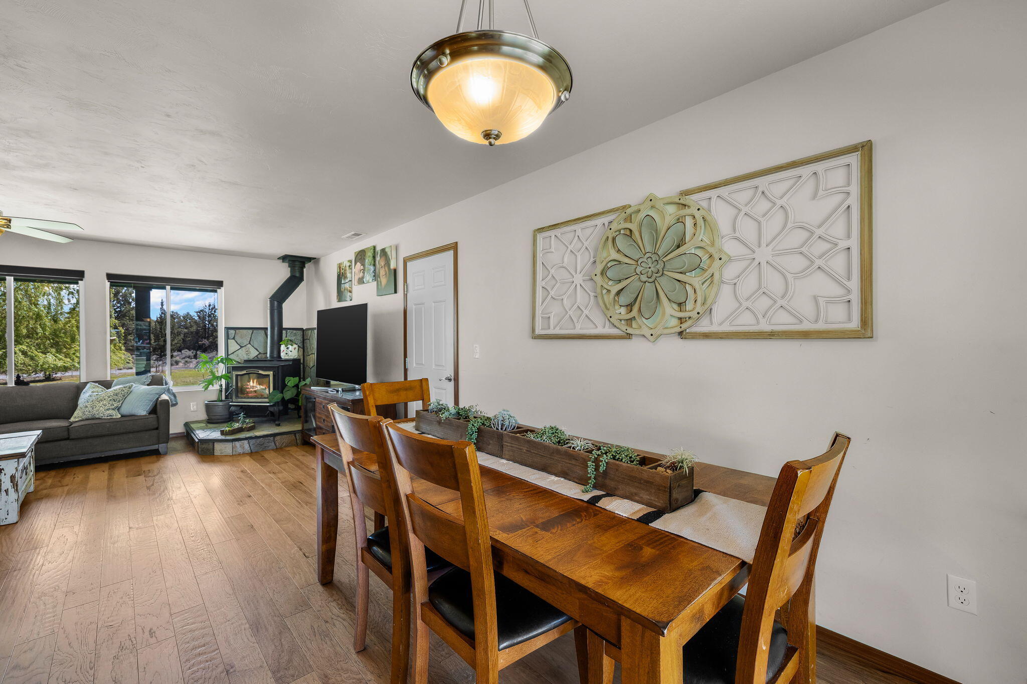 63639 Gentry Loop Bend, OR 97701 - Photo 14 of 40 a view of a dining room with furniture and wooden floor
