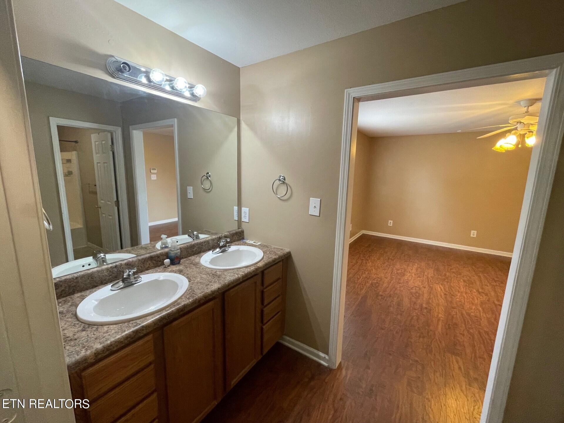 5409 Old Niles Ferry Road Maryville, TN 37801 - Photo 19 of 43 a bathroom with a granite countertop sink a mirror and a shower