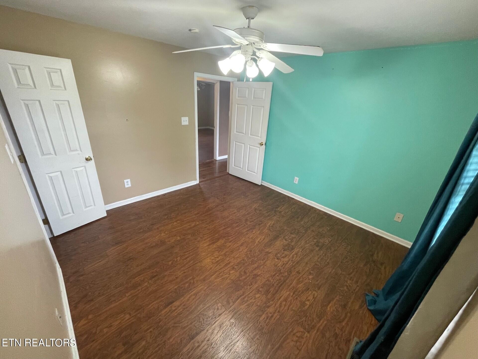 5409 Old Niles Ferry Road Maryville, TN 37801 - Photo 26 of 43 wooden floor in an empty room with a window