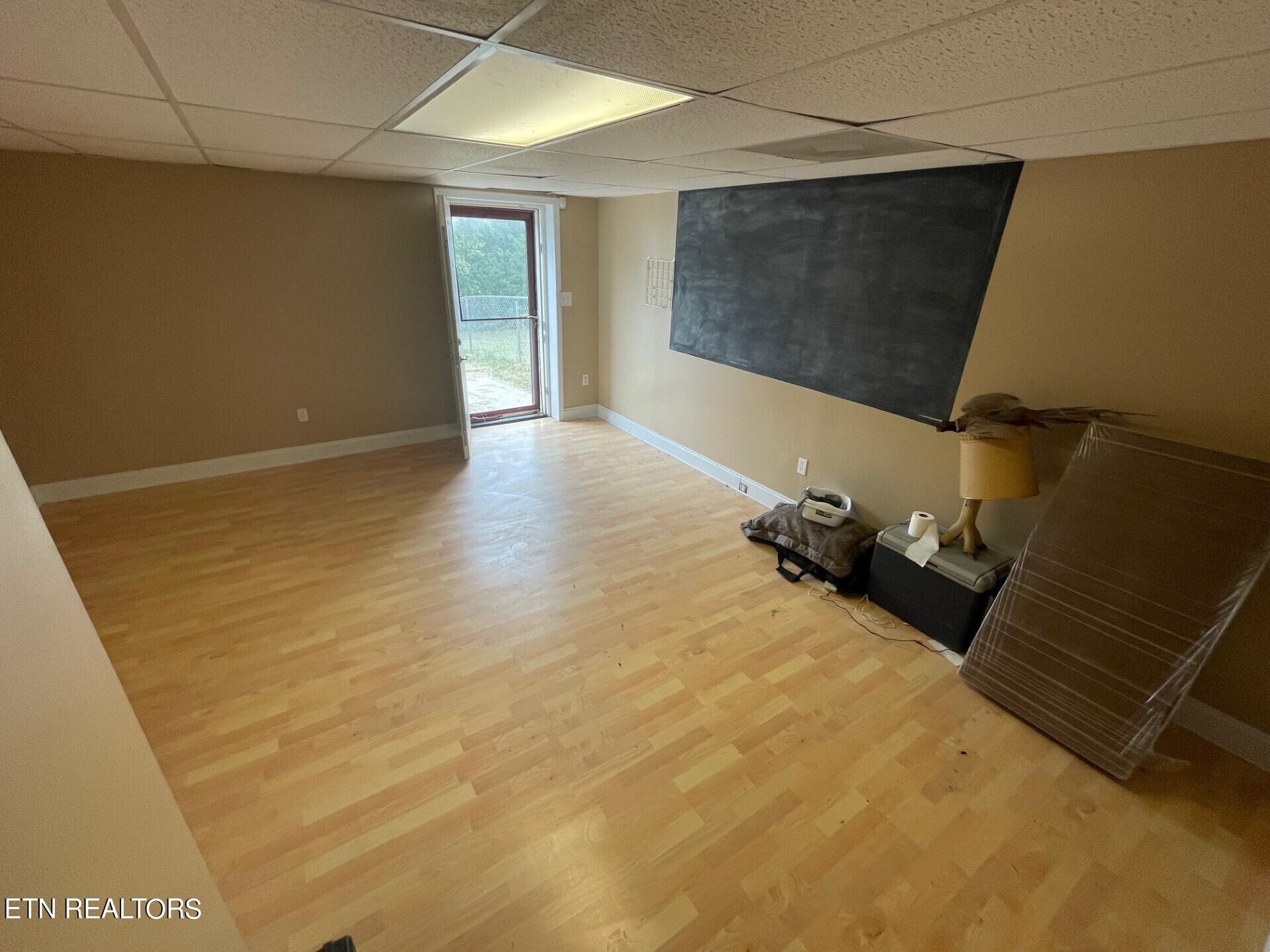 5409 Old Niles Ferry Road Maryville, TN 37801 - Photo 36 of 43 a room with a wooden floor and a ceiling fan