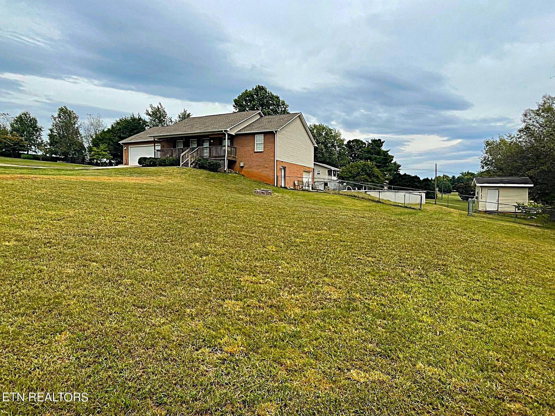 5409 Old Niles Ferry Road Maryville, TN 37801 - Photo 40 of 43 a house view with swimming pool in front of it