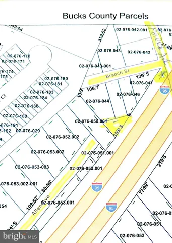 a view of a yard with a large tree