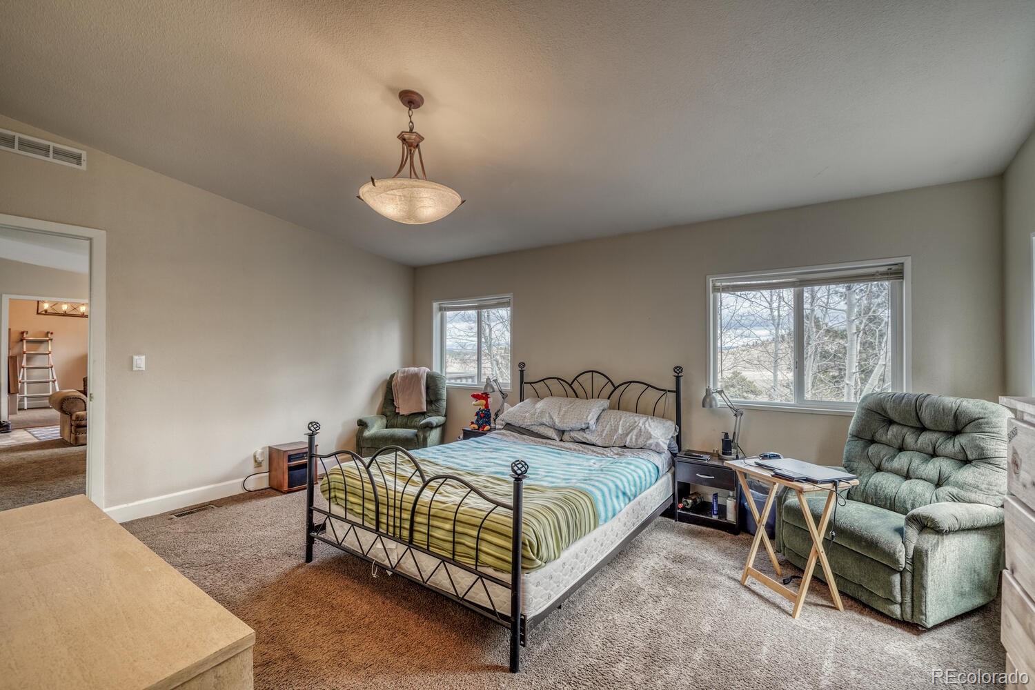 246 Sombrero Road Hartsel, CO 80449 - Photo 8 of 35 a bedroom with a bed and window