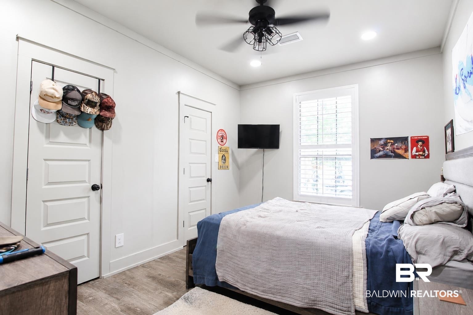 9825 Wolf Creek Ridge Elberta, AL 36530 - Photo 23 of 76 Room featuring wood-finish flooring, recessed lighting, and a ceiling fan with a cage-style light fixture