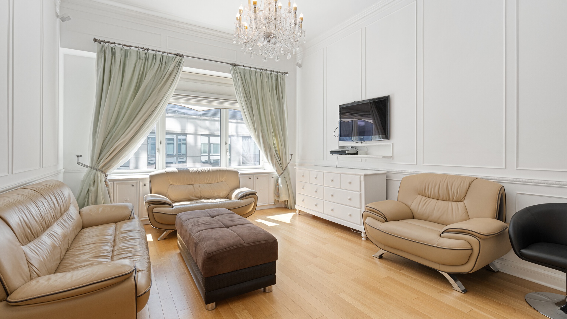 80 Riverside Boulevard, Unit 7A Manhattan, NY 10069 - Photo 2 of 23 a living room with furniture a flat screen tv and a large window
