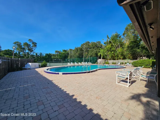 a view of an outdoor space and tennis court