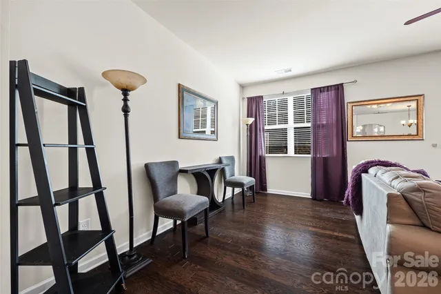 a view of a livingroom with furniture and a window