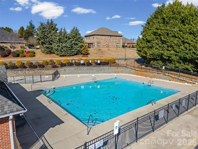 a view of a swimming pool with a lounge chairs