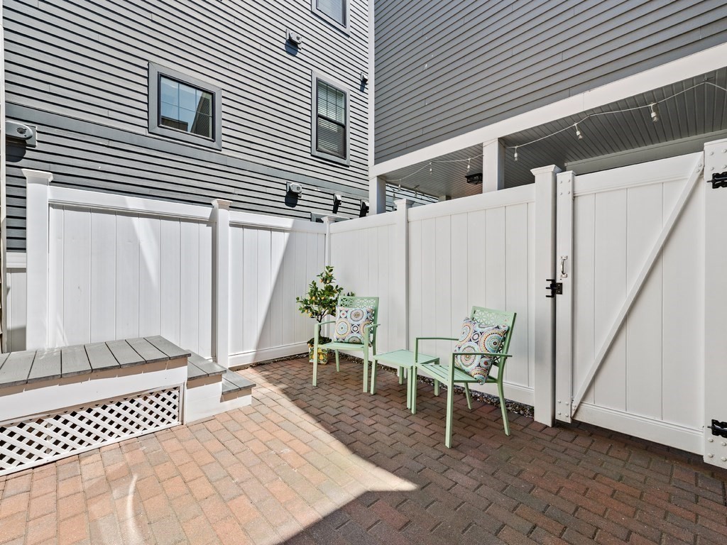 18 R Polk Street Boston, MA 02129 - Photo 17 of 19 a patio with table and chairs