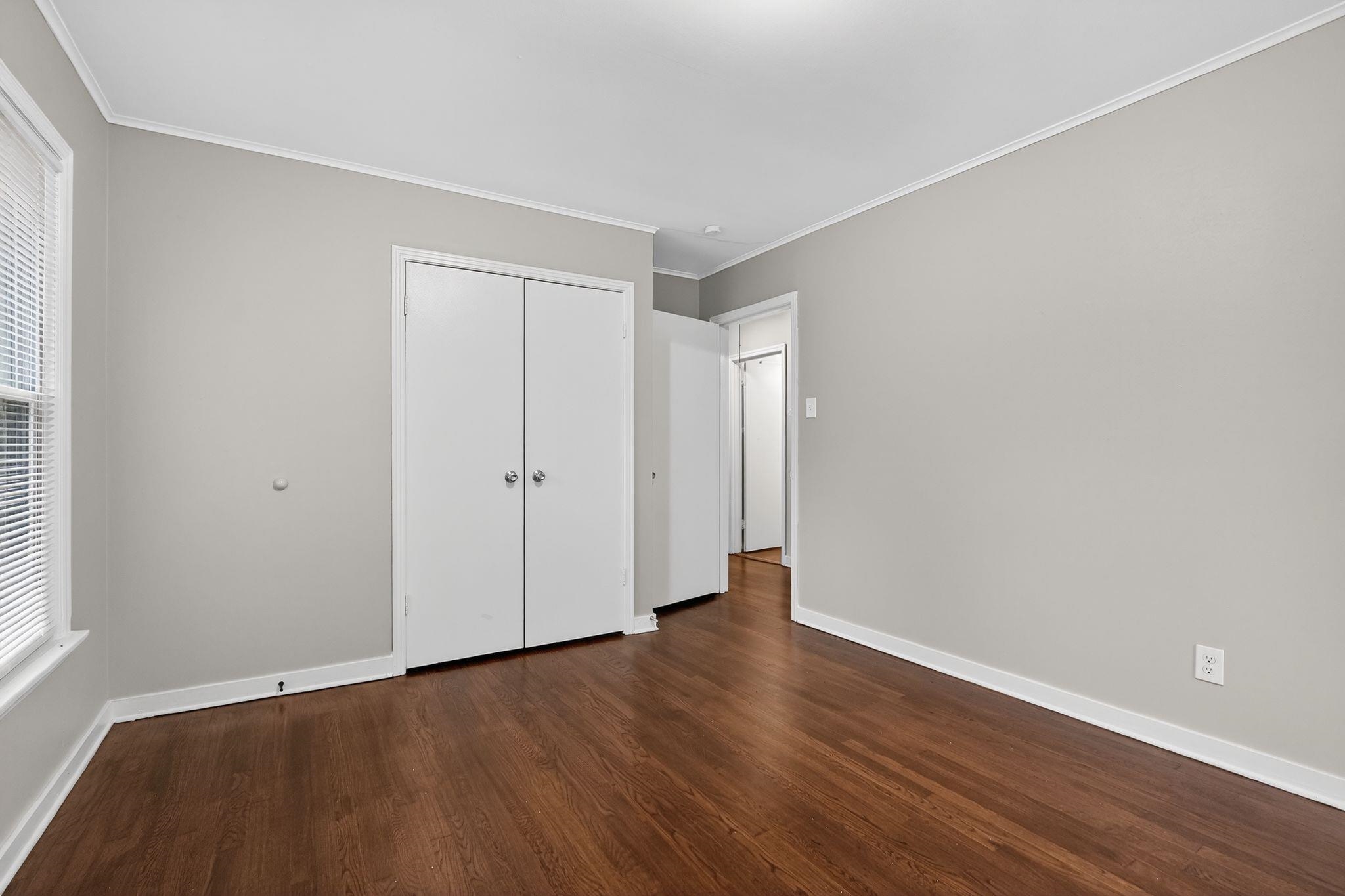177 East Raines Road Memphis, TN 38109 - Photo 17 of 32 a view of an empty room with wooden floor