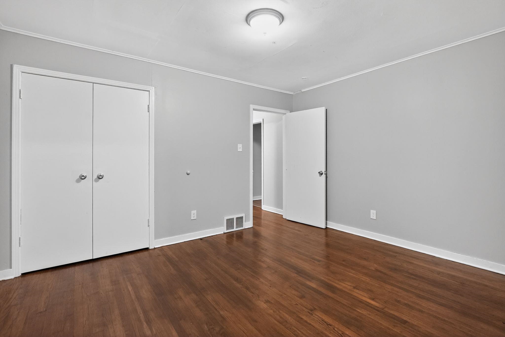 177 East Raines Road Memphis, TN 38109 - Photo 18 of 32 a view of an empty room with wooden floor