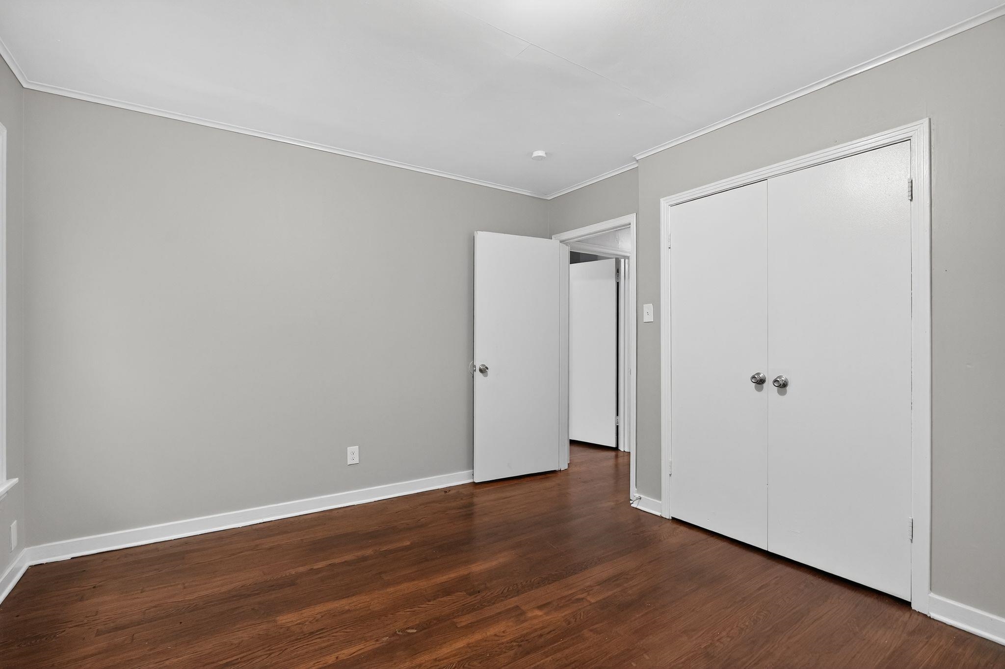 177 East Raines Road Memphis, TN 38109 - Photo 21 of 32 a view of an empty room with wooden floor
