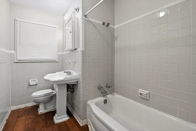 a bathroom with a sink toilet and bathtub