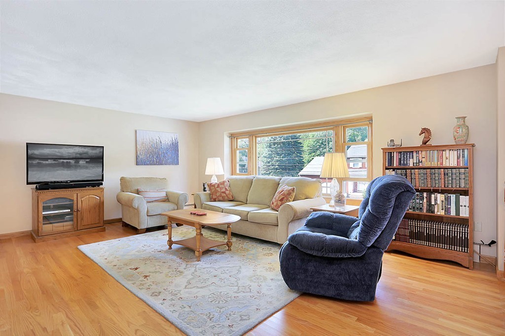 69 Haystack Road Reading, MA 01867 - Photo 4 of 30 a living room with furniture and a flat screen tv