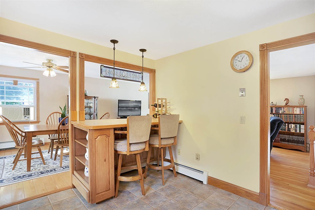 69 Haystack Road Reading, MA 01867 - Photo 7 of 30 a dining room with a table and chairs