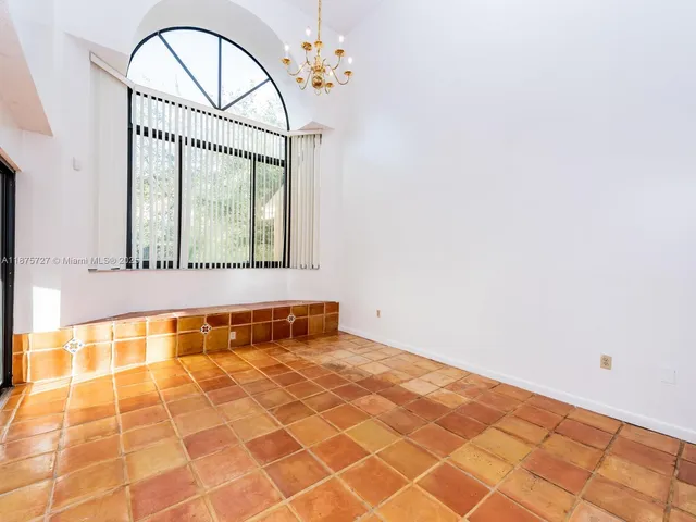a bathroom with a bathtub and a window