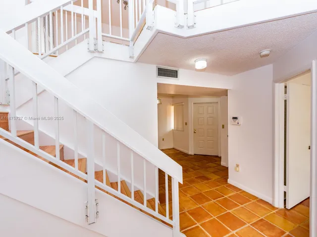 a view of an entryway with staircase
