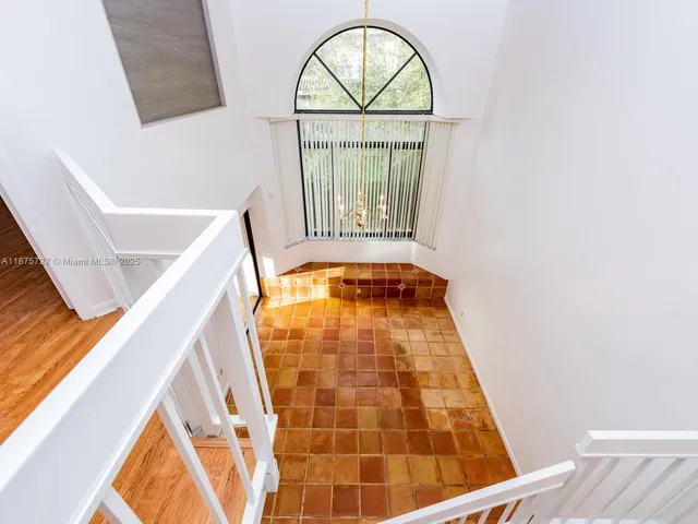 a view of bathroom with bathtub and window