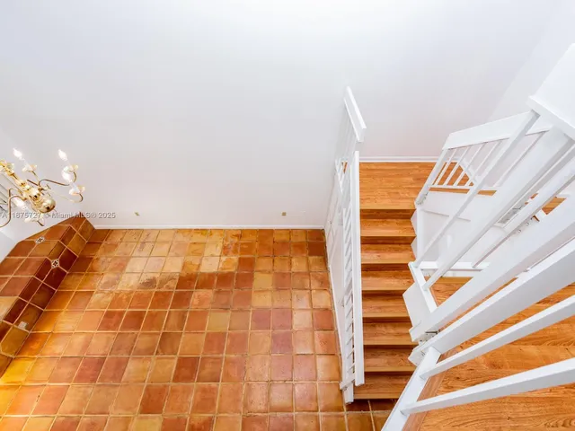 a view of an empty room with stairs