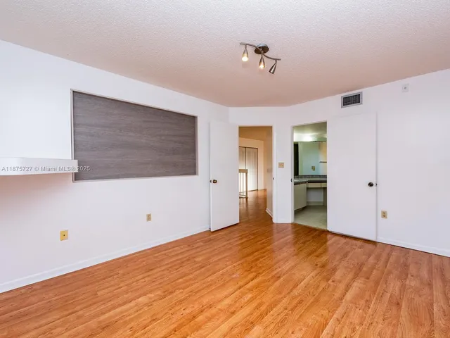 a bathroom with a sink a large mirror and a bathtub