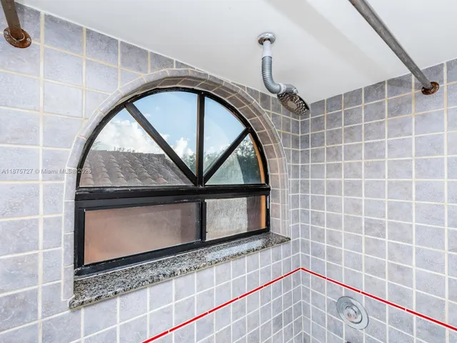 a view of a room with wooden floor and cabinet