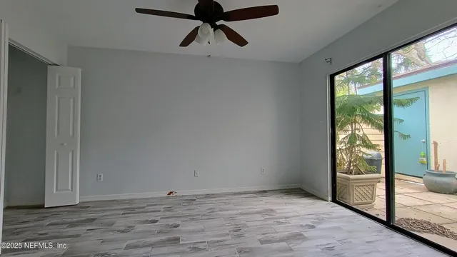 a view of entryway with wooden floor