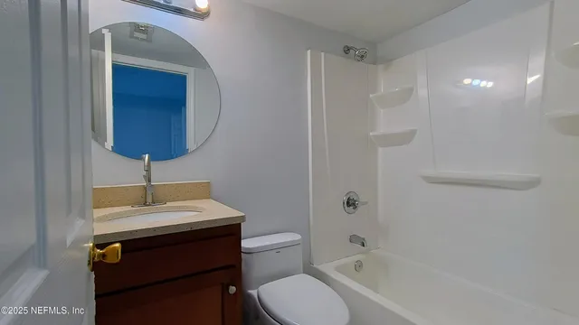 a bathroom with a toilet a sink and bathtub