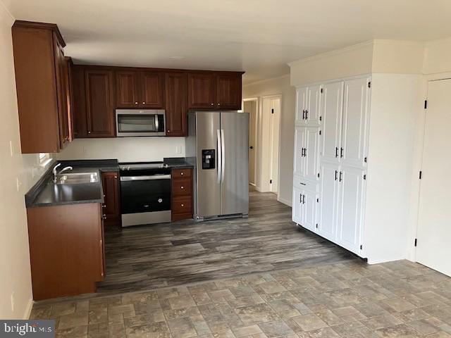121 Church Road Warwick, MD 21912 - Photo 11 of 29 a kitchen with stainless steel appliances granite countertop a refrigerator stove and sink