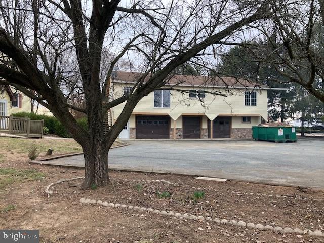 121 Church Road Warwick, MD 21912 - Photo 20 of 29 a view of a white house with a large tree next to a yard