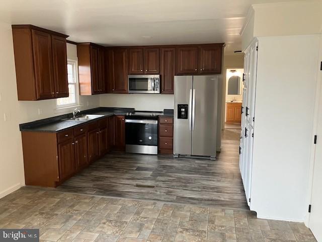 121 Church Road Warwick, MD 21912 - Photo 10 of 29 a large kitchen with stainless steel appliances granite countertop a stove a refrigerator and a sink