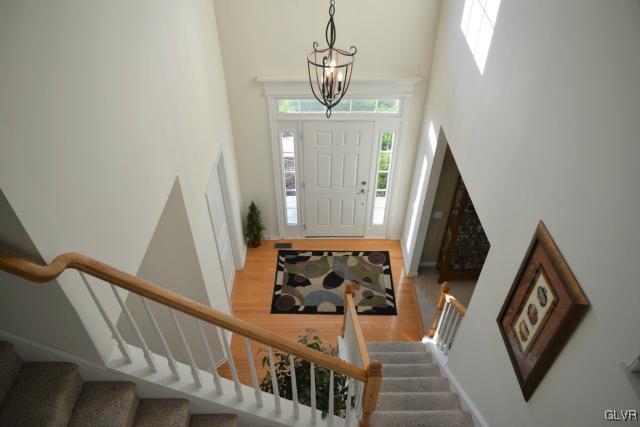 9067 Pathfinder Road Breinigsville, PA 18031 - Photo 14 of 36 GRACIOUS FOYER W/TURNED STAIRCASE