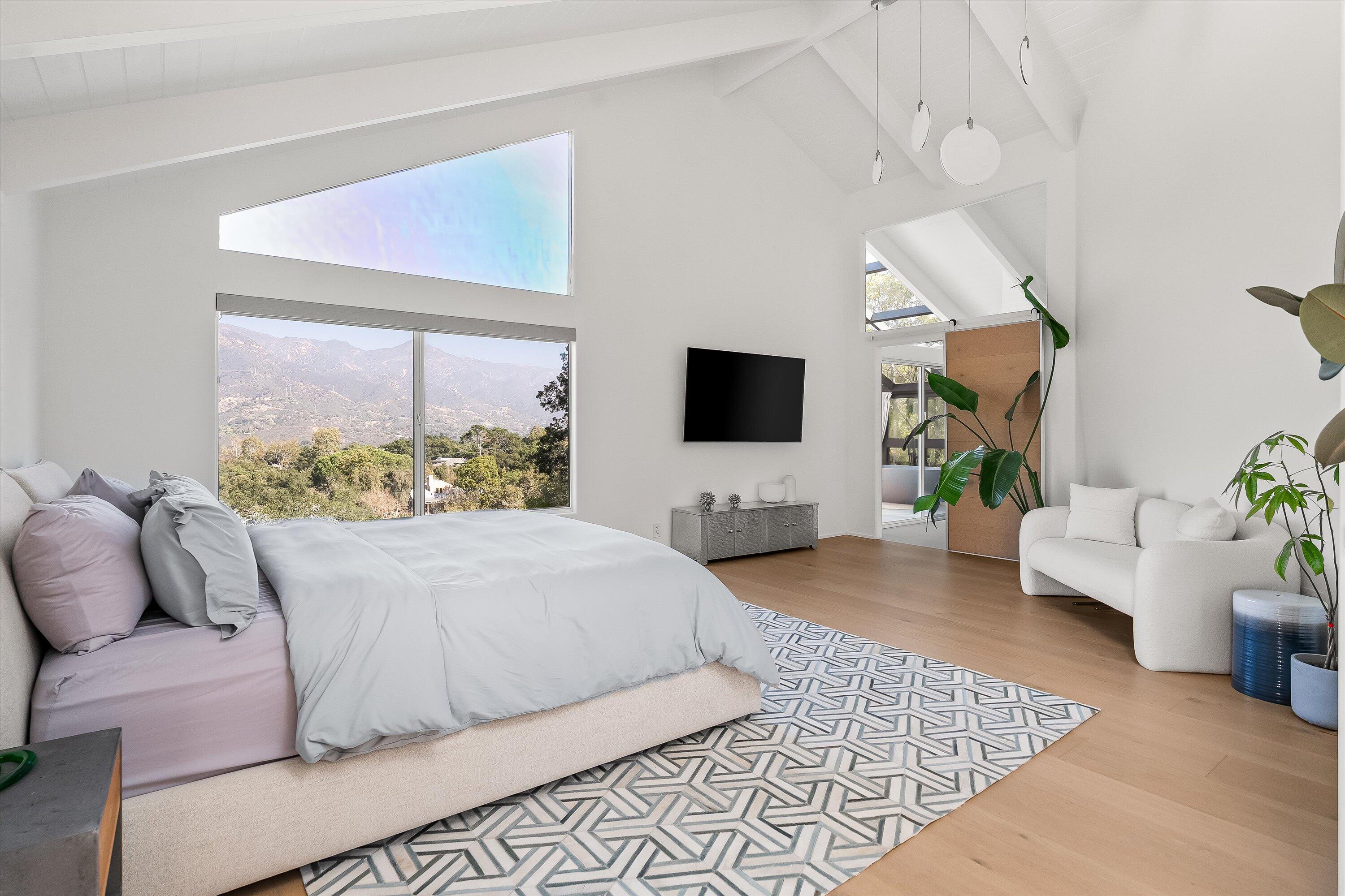 1438 Hillcrest Road Santa Barbara, CA 93103 - Photo 8 of 22 a living room with a couch and a flat screen tv