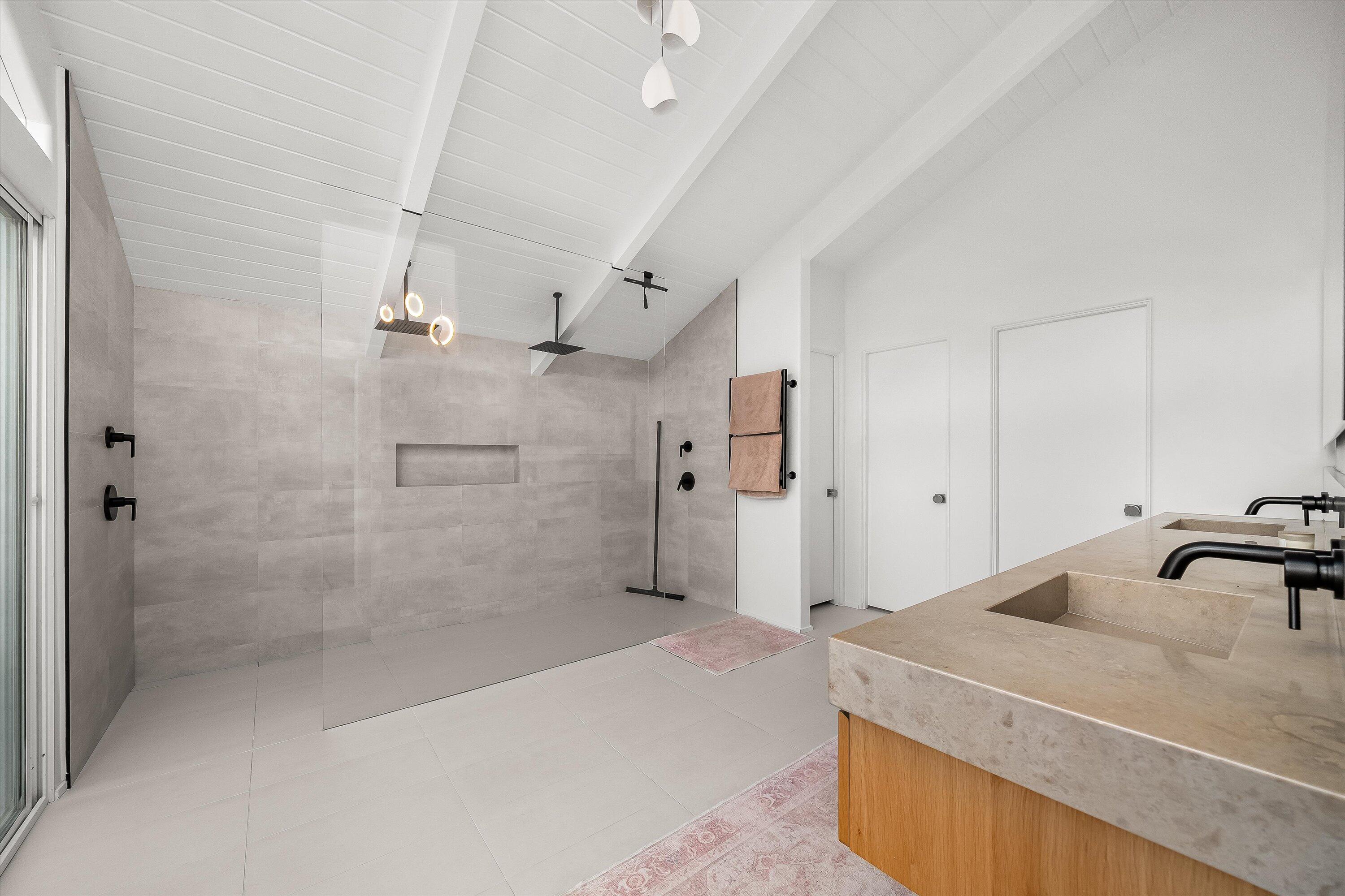 1438 Hillcrest Road Santa Barbara, CA 93103 - Photo 10 of 22 a spacious bathroom with a granite countertop sink a toilet and shower