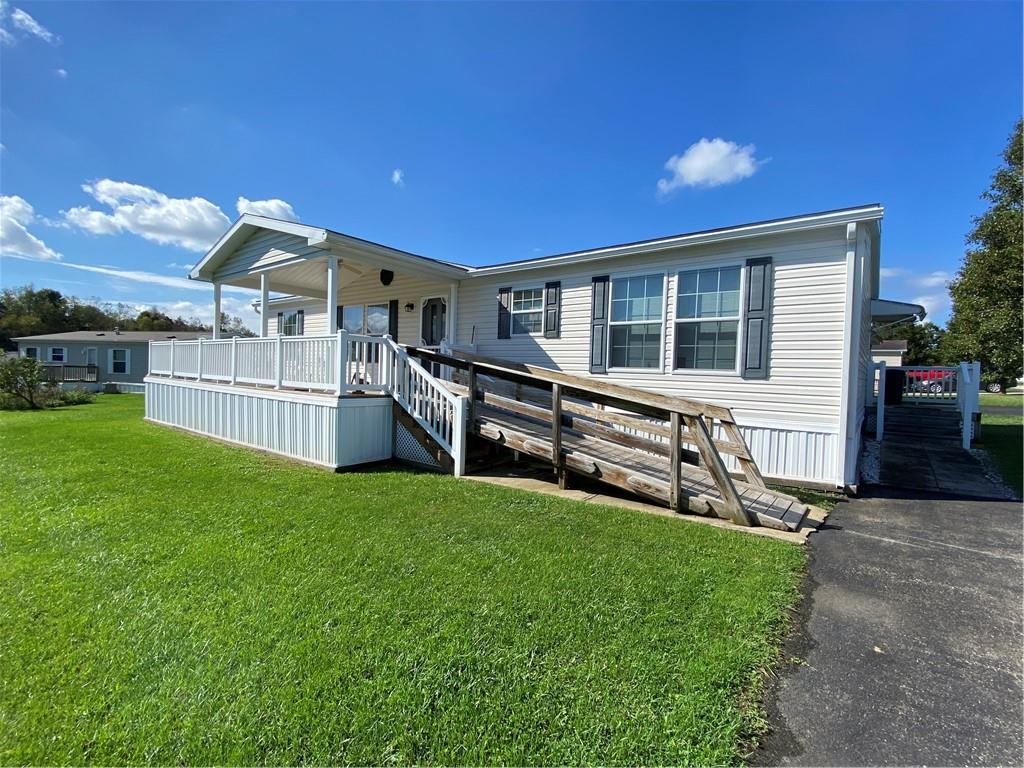 front view of a house with a yard