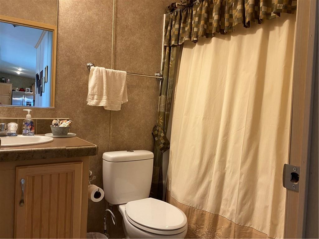 332 Iron Bite Drive Tarrs, PA 15688 - Photo 13 of 19 a bathroom with a granite countertop toilet and a sink