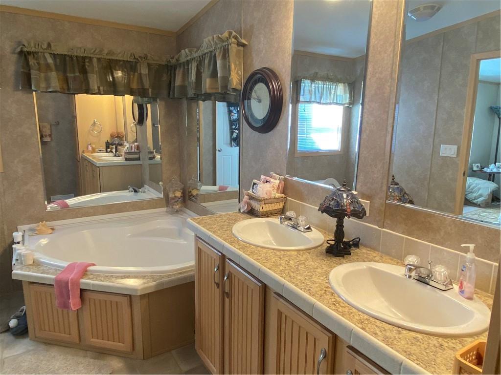 332 Iron Bite Drive Tarrs, PA 15688 - Photo 16 of 19 a bathroom with a granite countertop sink and a mirror