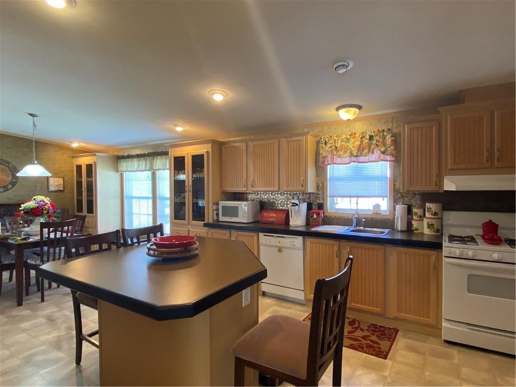 332 Iron Bite Drive Tarrs, PA 15688 - Photo 6 of 19 a kitchen with lots of counter top space and dining table