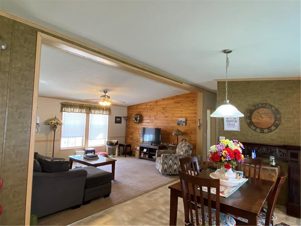 332 Iron Bite Drive Tarrs, PA 15688 - Photo 8 of 19 a living room with furniture a chandelier and a flat screen tv