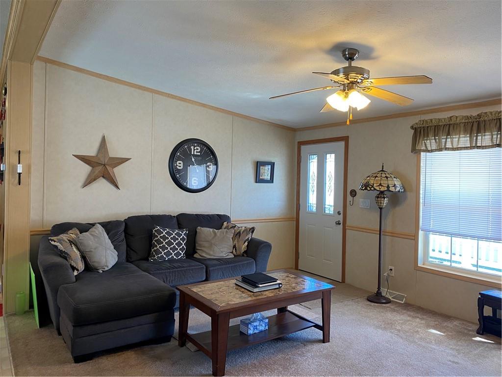 332 Iron Bite Drive Tarrs, PA 15688 - Photo 10 of 19 a living room with furniture a ceiling fan and a window