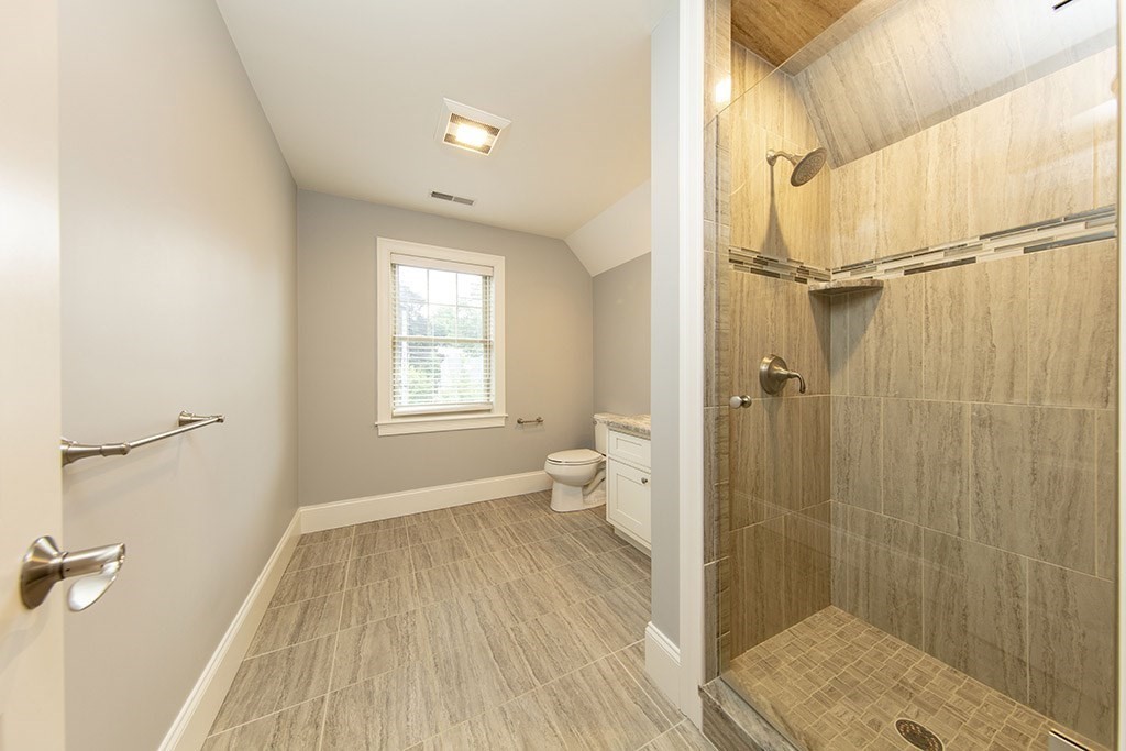 33 Liberty Avenue Lexington, MA 02420 - Photo 21 of 30 a bathroom with a sink and shower