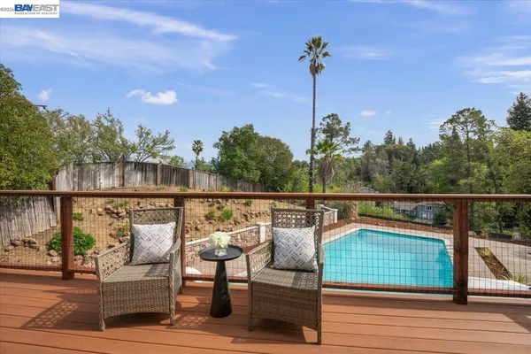 a view of a balcony with furniture