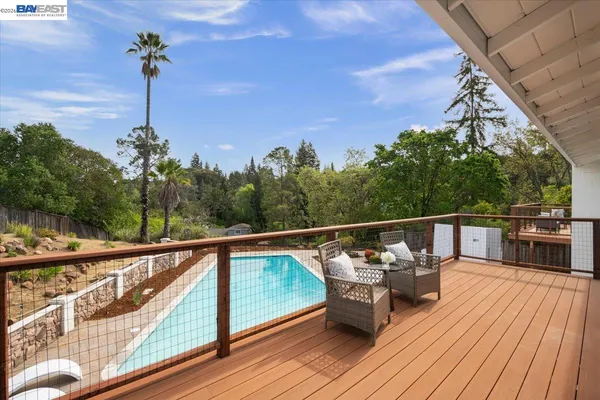 a view of a balcony with chairs
