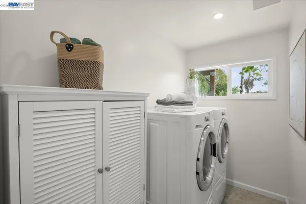 a view of storage and utility room with washer and dryer