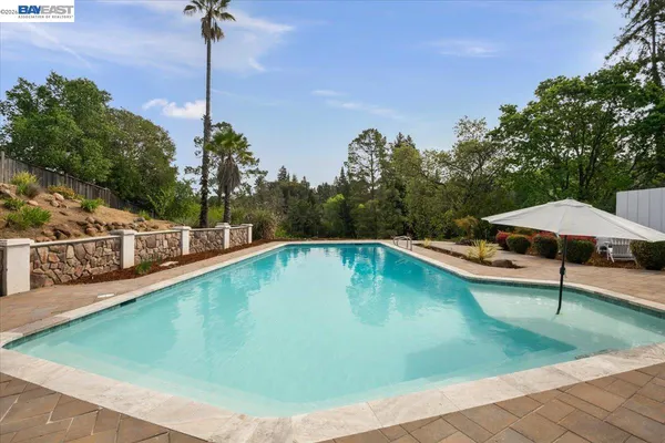 a view of a swimming pool with a deck